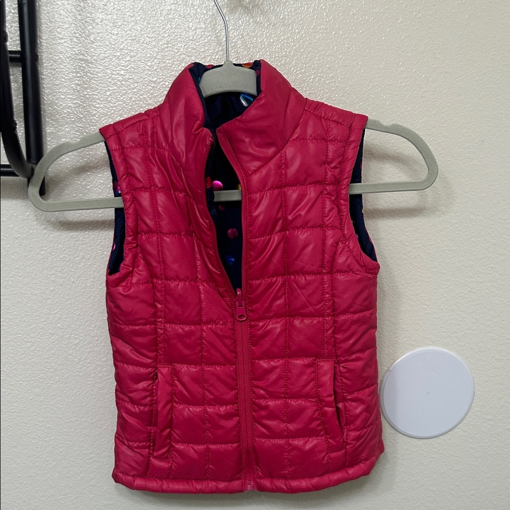 Reversible Girls Pink Quilted Vest with pockets.